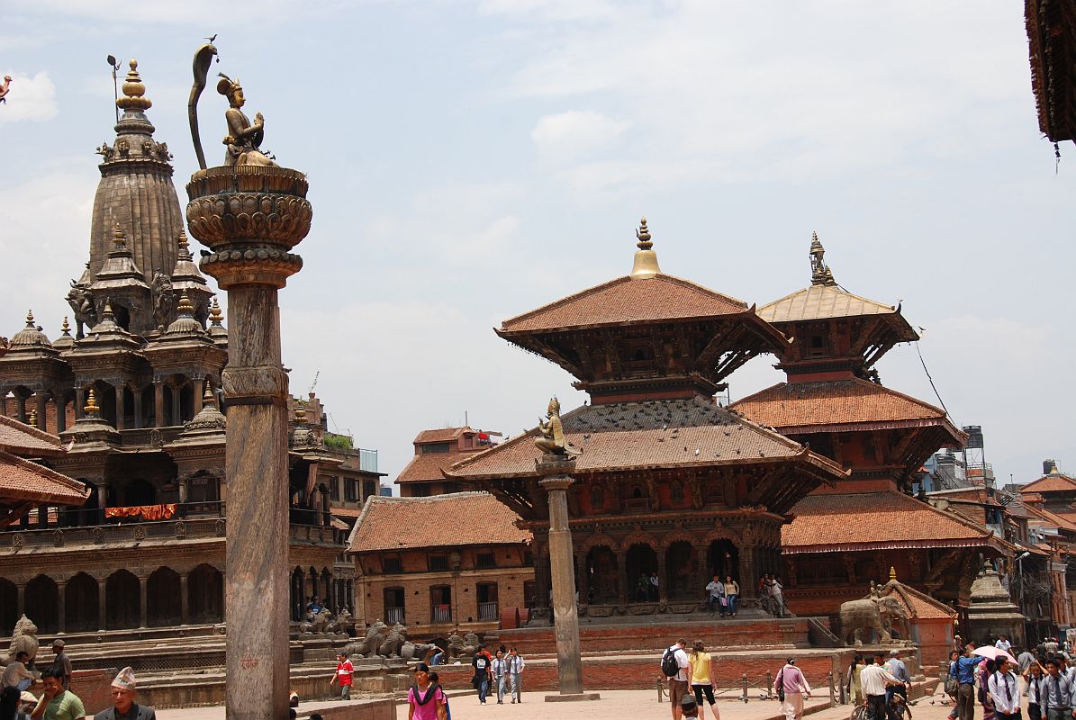 Kathmandu Patan Durbar Square 10 Krishna Mandir, King Yoganarendra Malla Column, Garuda Column, Vishwanath Temple, And Bhimsen Temple The Krishna Mandir temple, King Yoganarendra Malla column, Garuda column, Vishwanath Temple, and Bhimsen Temple occupy the west side of Patans Durbar Square. Vishwanath (Shiva) Temple (1627) is an elaborately decorated two-roofed temple with two stone elephants guarding the entrance. The Bhimsen Temple (1682) at the northern end of Durbar Square is a three-story temple dedicated to the god of trade and business.